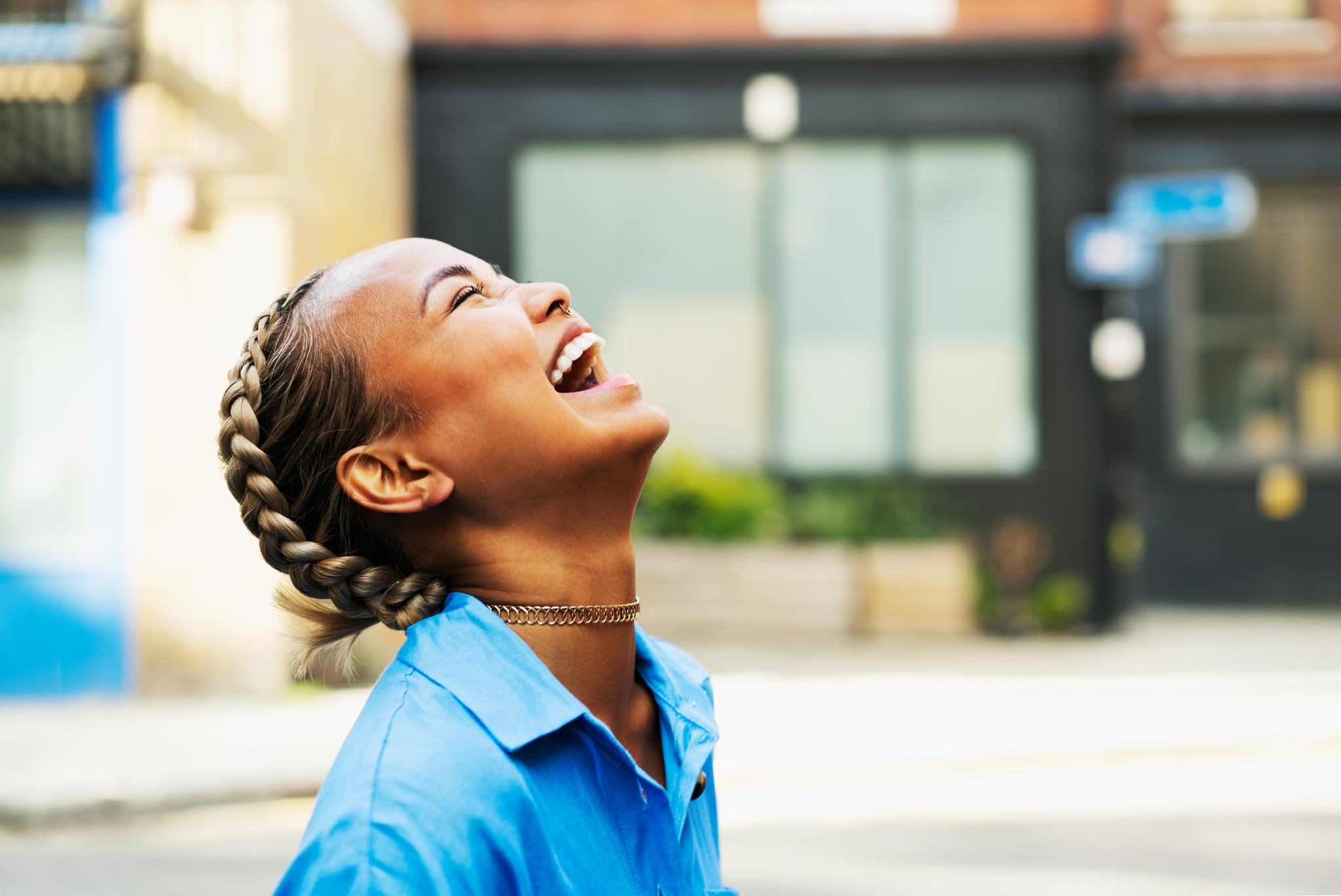 Side Profile of Woman Laughing With Face Pointed Toward Sky