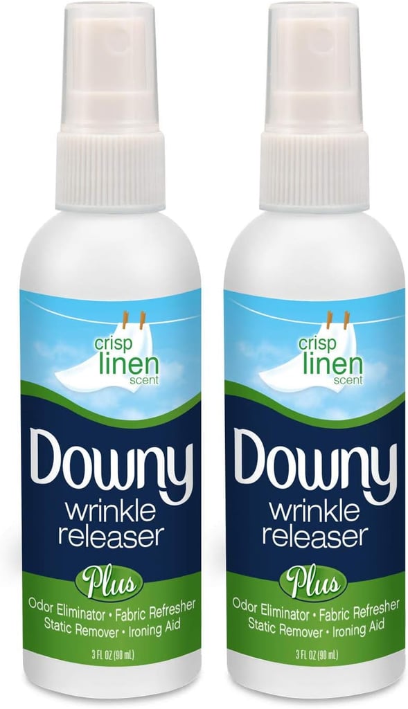Downy Wrinkle Release Spray ($10)
While many high-end London hotels come equipped with in-room ironing boards, others do not — which means you either need to travel with a portable steamer or opt for something more space-friendly like this Downy Wrinkle Release Spray. It's easy to use; simply spray it on the fabric of choice (ideally lighter, more delicate pieces), tug and smooth out wrinkles, then allow it some time to dry. Not only is it effective at lifting wrinkles from clothes, but it also boasts a fresh linen scent that masks odors, too.
