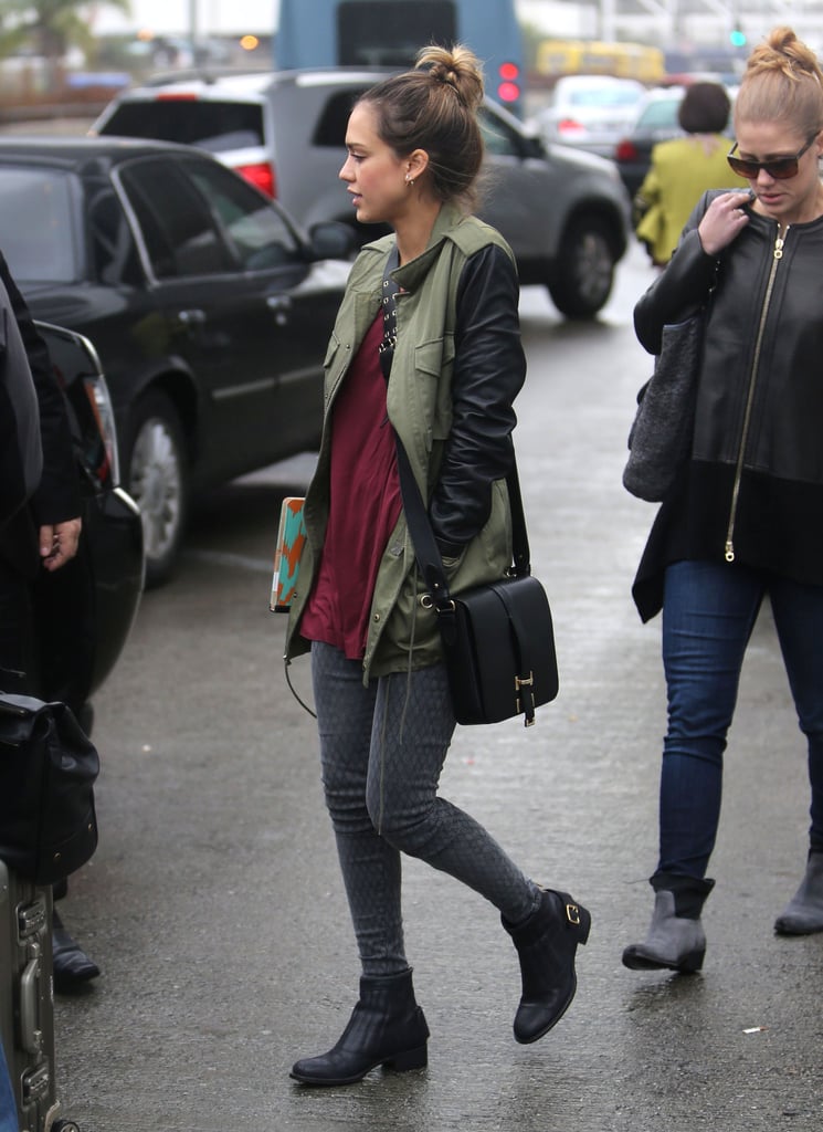 Even a rainy day can't damper Jessica's killer style. The model mom bundled up in a leather-sleeved military jacket by Sanctuary, fishnet-print Current/Elliott denim, and leather Rupert Sanderson ankle boots.
