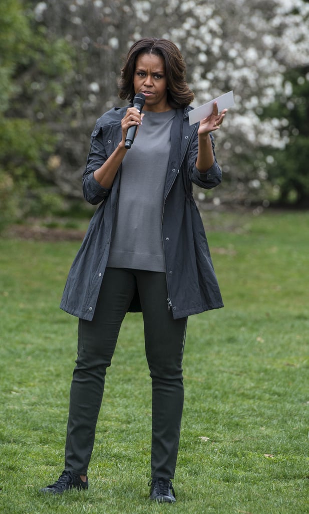 When she joined local children to plant the sixth annual White House Kitchen Garden, Michelle kept it casual and comfortable in black straight-leg jeans, which she wore with a gray sweatshirt, a raincoat, and black leather sneakers.