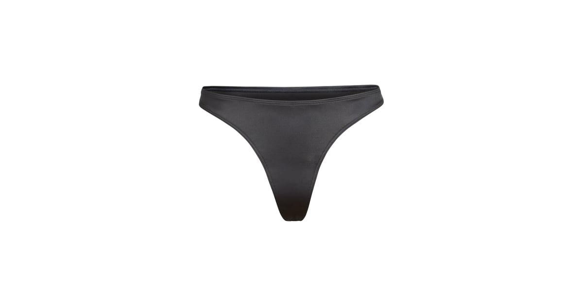 Skims Stretch Satin Thong in Onyx | Kim Kardashian Skims Stretch Satin Collection â Photos 