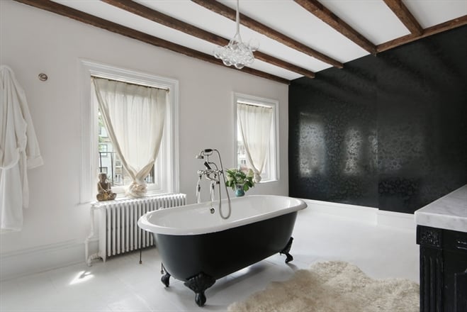 The bathroom has three windows and a skylight.