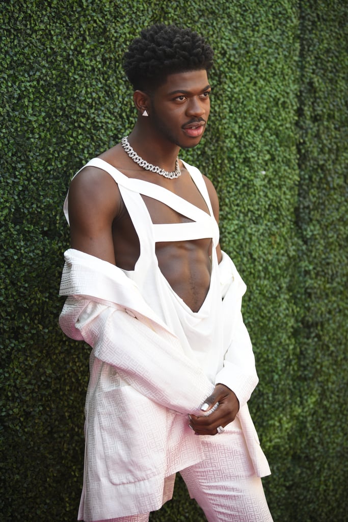 Lil Nas X Wears a White Balmain Pantsuit and Bandage Top