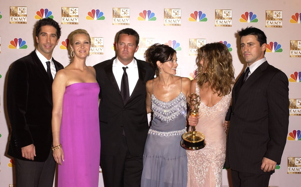 The cast posed for photos in the press room after winning an Emmy in 2002.