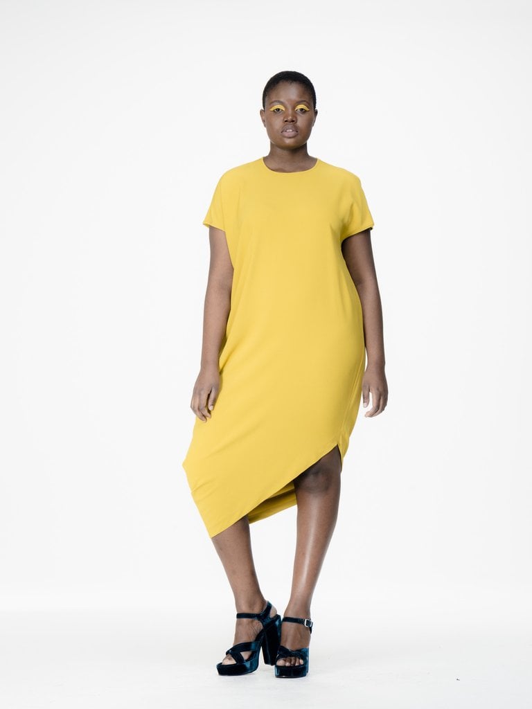 You'll love the asymmetric cut of Universal Standard's Augusta Geneva Dress in Mustard ($180)
