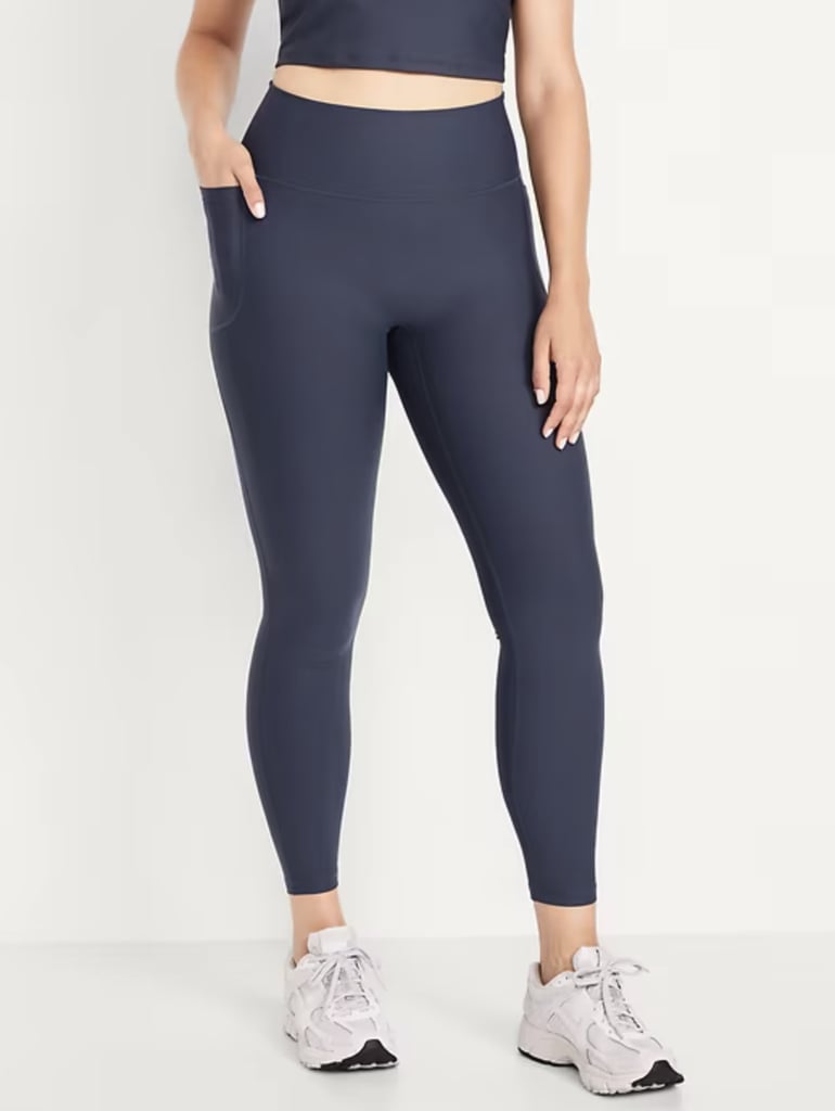 Old Navy High-Waisted PowerSoft Ribbed Leggings  ($20, originally $40)
Old Navy's Boundless collection has four-way stretch, they're moisture-wicking, breathable, and even have a deep pocket to hold your phone (unlike those throwaway pockets that could barely fit a ring). They're a great butt-lifting option, especially for the price.
Pros: Deep pocket large enough to hold your phone.
Cons: According to reviews, these leggings run a bit small. It's recommended to size up.
Material: Recycled polyester and spandex
Length: 7/8 in regular, tall, and petite
Colorways: 10
Sizes: XS–4X
Who It's Best For: Anyone looking for stretchy, butt-enhancing leggings with pockets on both sides.
Extras: No front-rise seam for a smoother feel.
What Reviewers Say: "I am almost 5'8" and 120lbs. Bought these leggings in a size XS for running and hiking. These are great, they have more compression than other ON leggings I have bought before - personally I would not size down because of this, but they do fit snug all over (just in a good way). I have a long torso and maybe could have almost purchased the tall, since they aren't super high-rise on me. Anyway, wore them running in the rain this morning and they were very comfortable, kept me warm without being a sweaty mess, didn't absorb the rain and get heavy, and they did not roll down, ride up, or shift at all. They feel more expensive than they are. Recommend!"