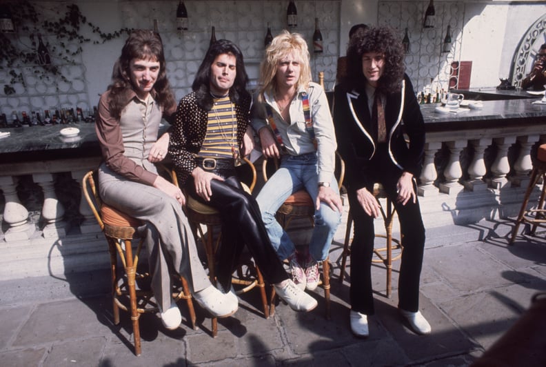 8th September 1976:  British rock group Queen at Les Ambassadeurs, where they were presented with silver, gold and platinum discs for sales in excess of one million of their hit single 'Bohemian Rhapsody'. The band are, from left to right, John Deacon, Fr