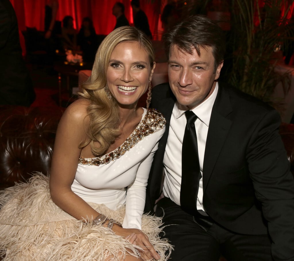 Heidi Klum hammed it up with Nathan Fillion post award show.
Heidi Klum hammed it up with Nathan Fillion post award show.