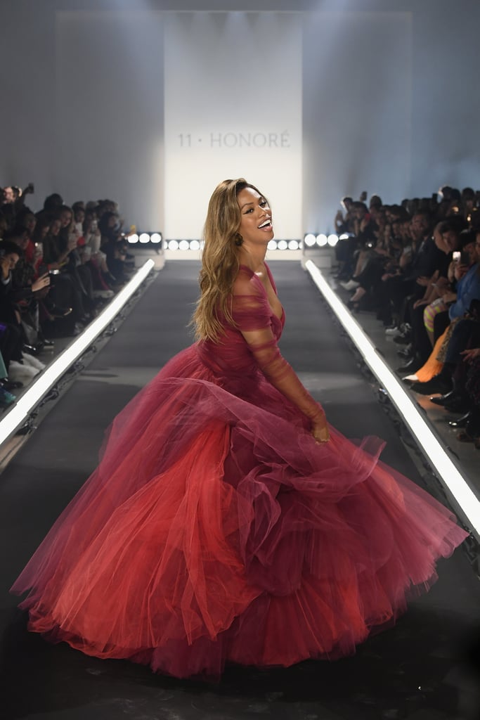 New York Fashion Week started — and, truthfully, ended — with a twirl. On Feb. 6, size-inclusive shopping destination 11 Honoré hosted its first-ever runway show, with Laverne Cox leading the charge. Wearing a burgundy gown by Zac Posen, the actress spun down the runway while Robyn's "Honey" thumped in the background. The exuberant runway moment is already being considered a highlight of the season and stood out in an industry that often faces criticism for taking itself too seriously.
If the burgundy gown seems familiar, it's because Laverne isn't the first star to twirl in all of its tulle glory. Miley Cyrus wore the same design during her performance with Elton John at the 2018 Grammy Awards. The gown's designer was also in attendance at the award show, and Miley and Zac posed for several photos together backstage. Ahead, revel in the joyous Fashion Week moment and see pictures of the gown's previous appearance at the Grammys.

    Related:

            
            
                                    
                            

            8 New Street Style Trends You Can Expect to See All Over Fashion Week