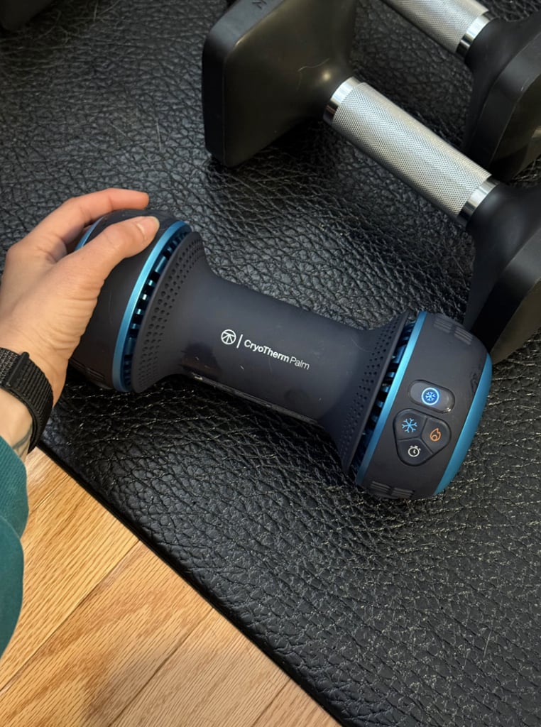 Therabody CryoTherm Palm ($400)
Leave it to Therabody to come out with another innovative way to level up your routine. The brand's latest launch helps lower your core body temperature mid-workout so you can maximize sets. Thanks to a preview ahead of launch, I'm already a huge fan of this device. 
Editor Quote: "Turn it on, and within seconds the blue sides are chilled enough to reduce your core body temperature. I've been holding it in between strength sets to delay fatigue and give myself the boost I need to push for more reps or a higher weight. Science has proven that it's also beneficial for runners, who boosted their speed and power after a session." - Sarah Wasilak, shopping director and social host