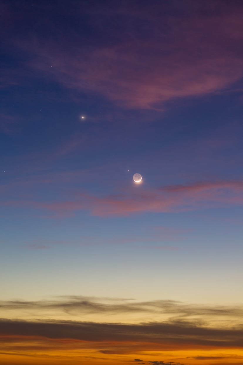 The beautiful twilight sky (Nov 28, 2019) after sunset with the planets conjuction of Moon (with earth shine), Venus and Jupiter.