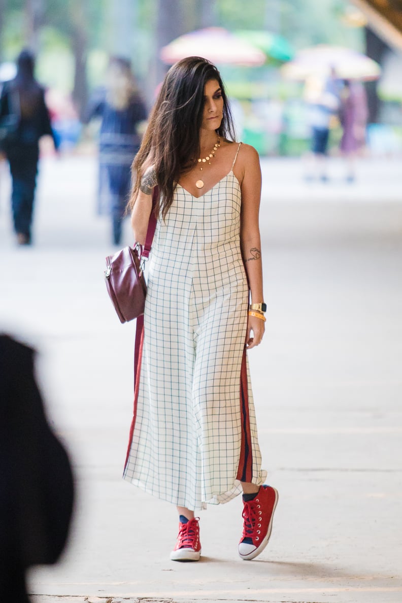 A Checkered Jumpsuit With Red Converse