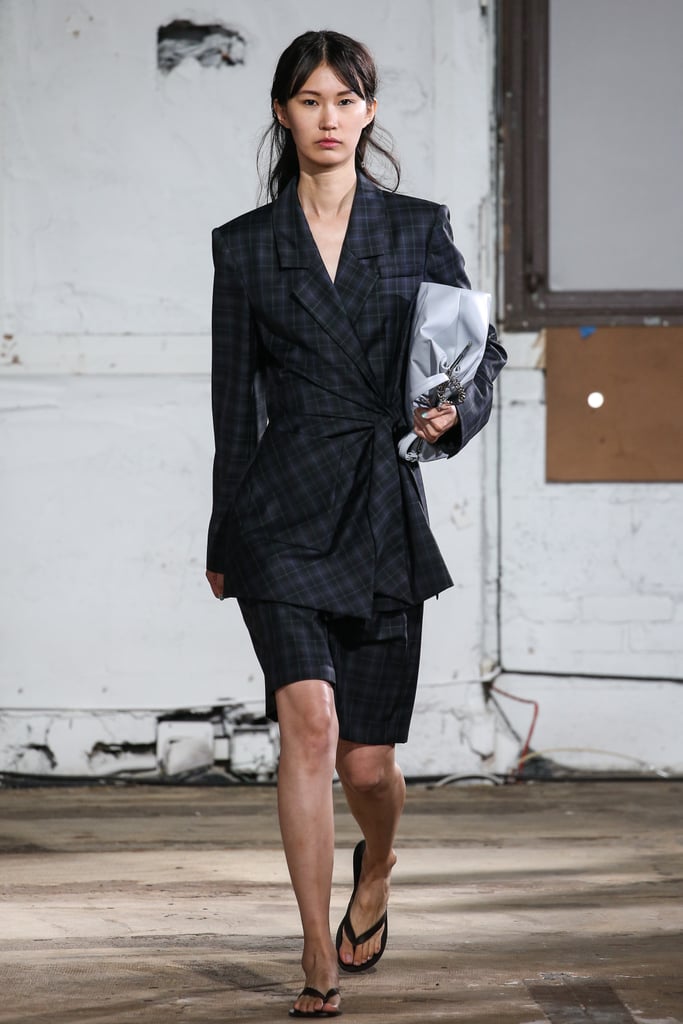 A model at the Tibi show pairing a checkered set with a black pair.