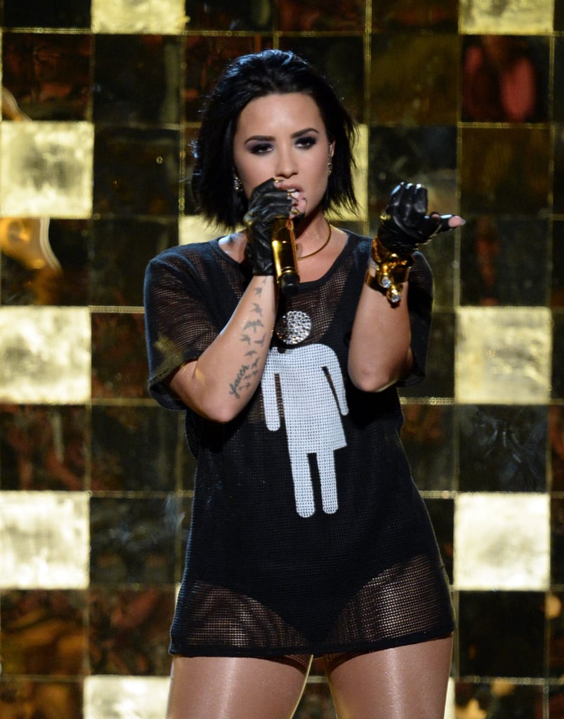 Demi Lovato Wearing Gender Neutral Bathroom Shirt on Stage