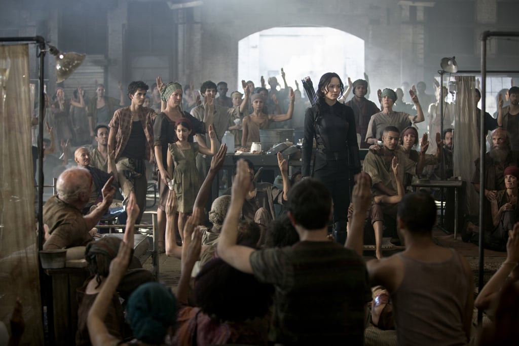 Everyone salutes the Mockingjay.