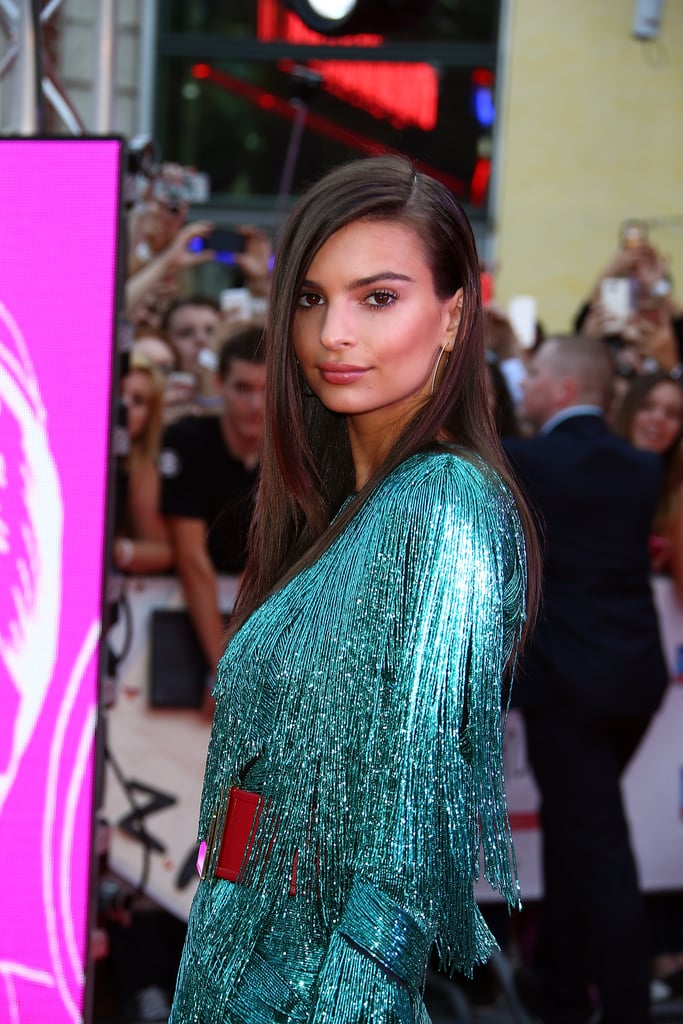 Fringe literally dripping from her neckline to her sleeves.