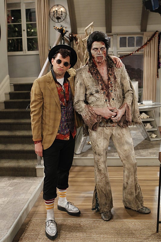 Cryer poses with Ashton Kutcher, as Dead Elvis.