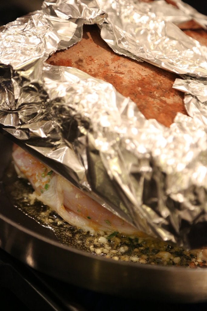 Cook chicken breasts under a brick.