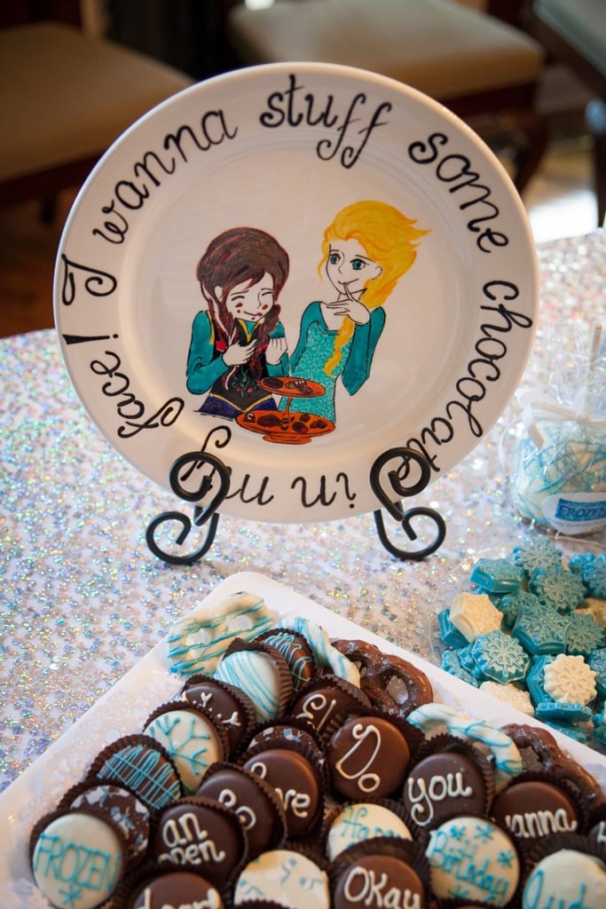 Anna strategically placed decorative plates near appropriate party foods. This adorable piece displays a quote about chocolate, so she arranged it next to the chocolate cookies.
