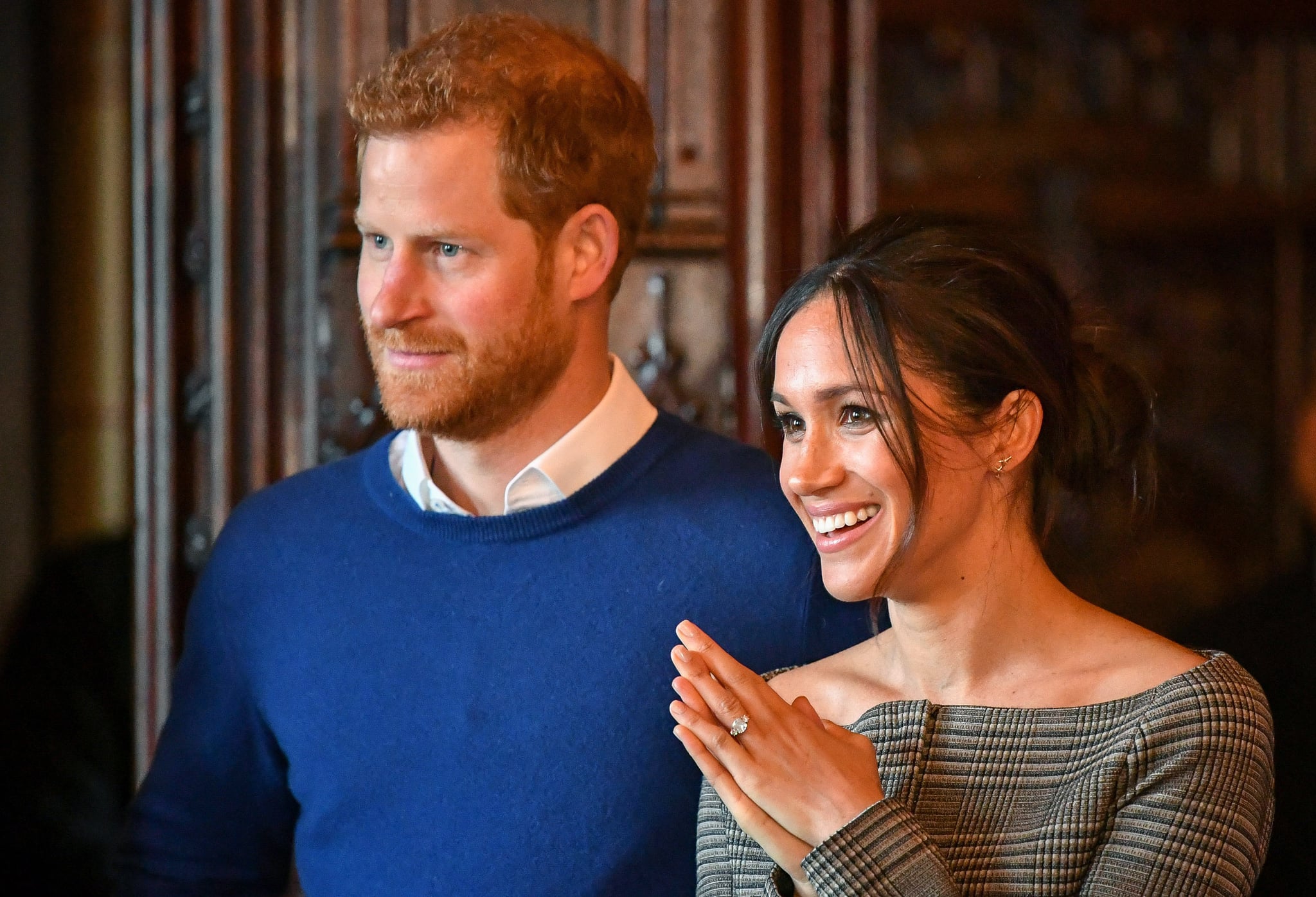 CARDIFF, WALES - JANUARY 18:  Prince Harry and Meghan Markle watch a performance by a Welsh choir in the banqueting hall during a visit to Cardiff Castle on January 18, 2018 in Cardiff, Wales. (Photo by Ben Birchall - WPA Pool / Getty Images)