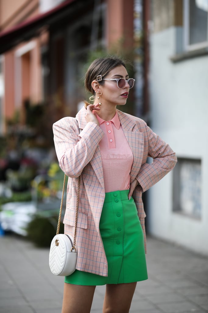 A bright polo shirt and miniskirt put a modern spin on country club attire.