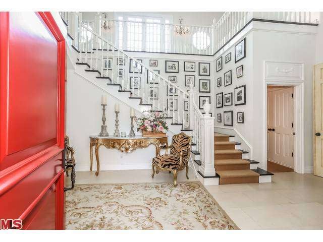 Stairs lead up to private family quarters that include grand bedrooms for the couple and their children.