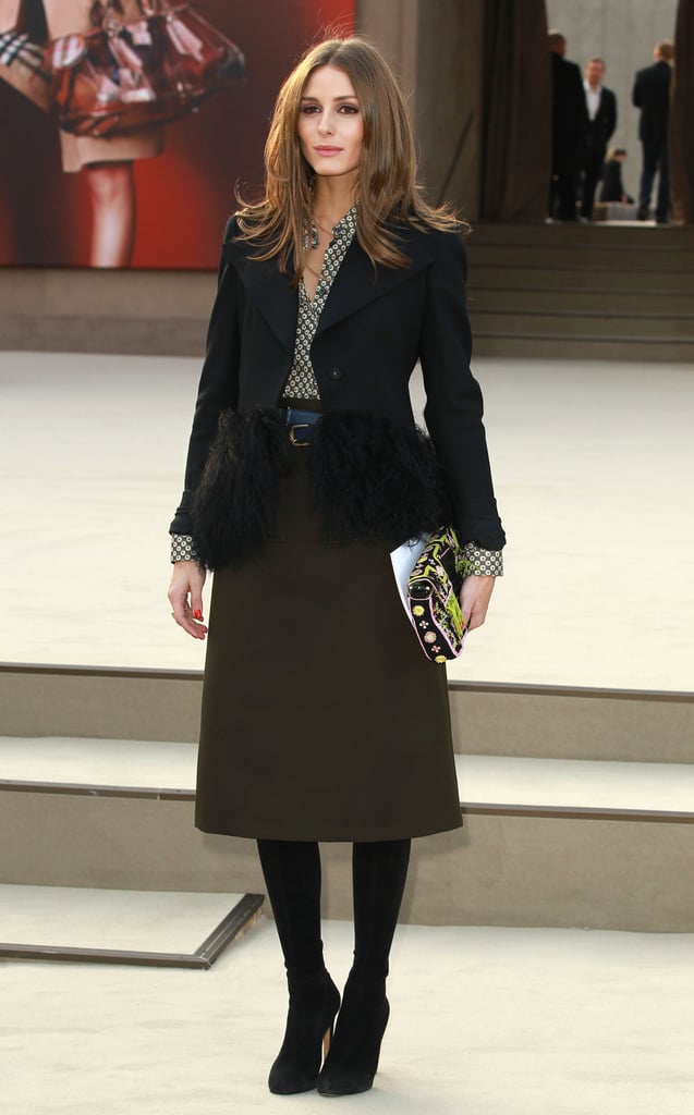 At the Burberry Prorsum show in London, Olivia took ladylike-chic to new heights in a printed blouse, a knee-length olive skirt, and a fur-trim Armani blazer. Her neon Fendi clutch injected the perfect dash of colour.
At the Burberry Prorsum show in London, Olivia took ladylike-chic to new heights in a printed blouse, a knee-length olive skirt, and a fur-trim Armani blazer. Her neon Fendi clutch injected the perfect dash of colour.