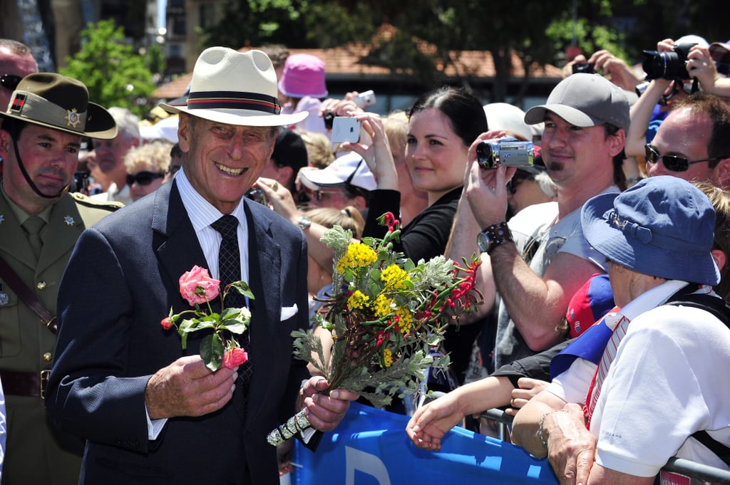 Prince Philip greeted the crowd with flowers at the Great Aussie BBQ on Oct. 29, 2011.