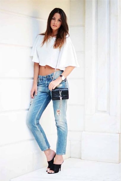 Give old jeans new life with a crop top and a pair of high-heeled mules for date night. 
Source: Instagram user zinafashionvibe