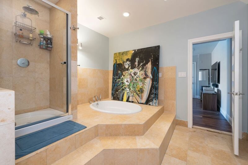 A spa-like bathroom is included in the total four and a half baths. We wouldn't mind getting pampered here!