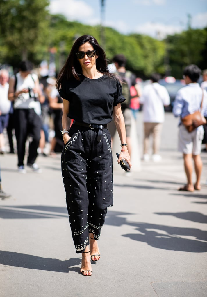 All-black feelings anything but boring when a simple t-shirt, heels, and embellished jeans are at play.