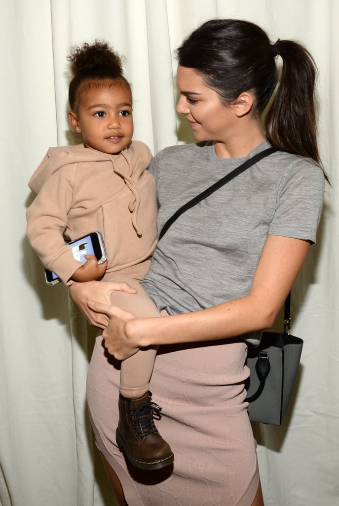 North accessorized her neutral sweats with brown Dr. Martens boots.