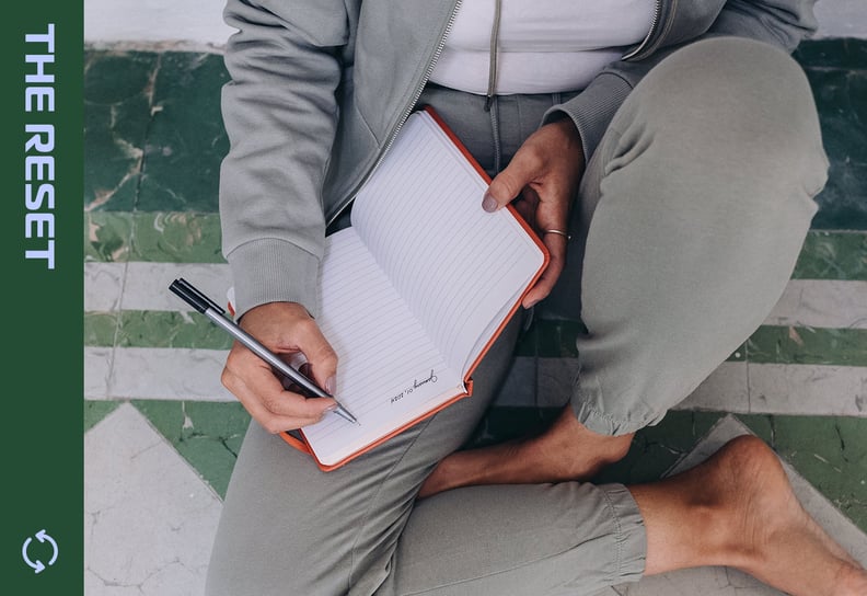 Young woman writing in gratitude journal