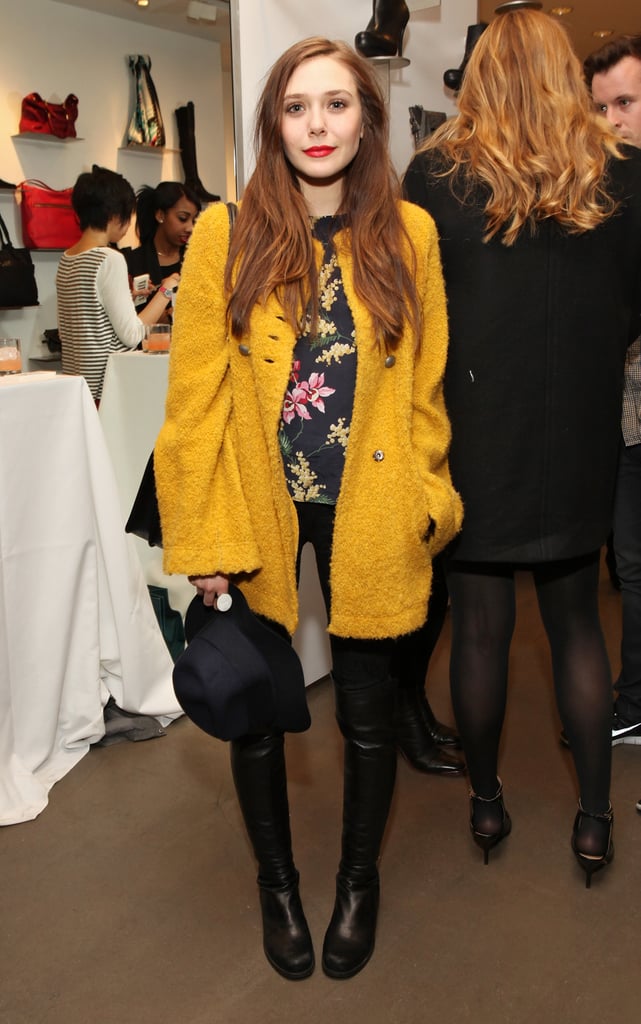 Elizabeth Olsen brightened her all-black bottoms with a floral blouse and nubby yellow coat while perusing the Cher Coulter capsule collection for AG Jeans.
Elizabeth Olsen brightened her all-black bottoms with a floral blouse and nubby yellow coat while perusing the Cher Coulter capsule collection for AG Jeans.