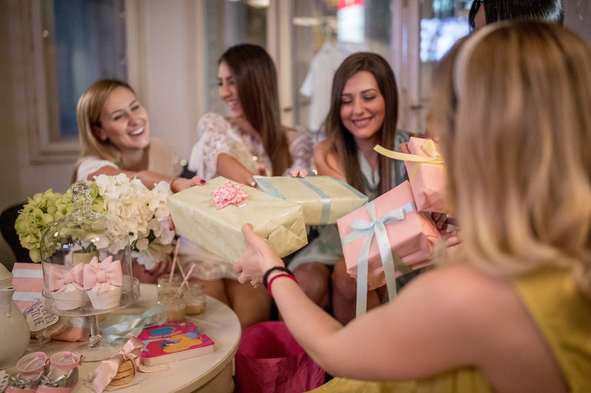 Pregnant woman and her friends at baby shower party