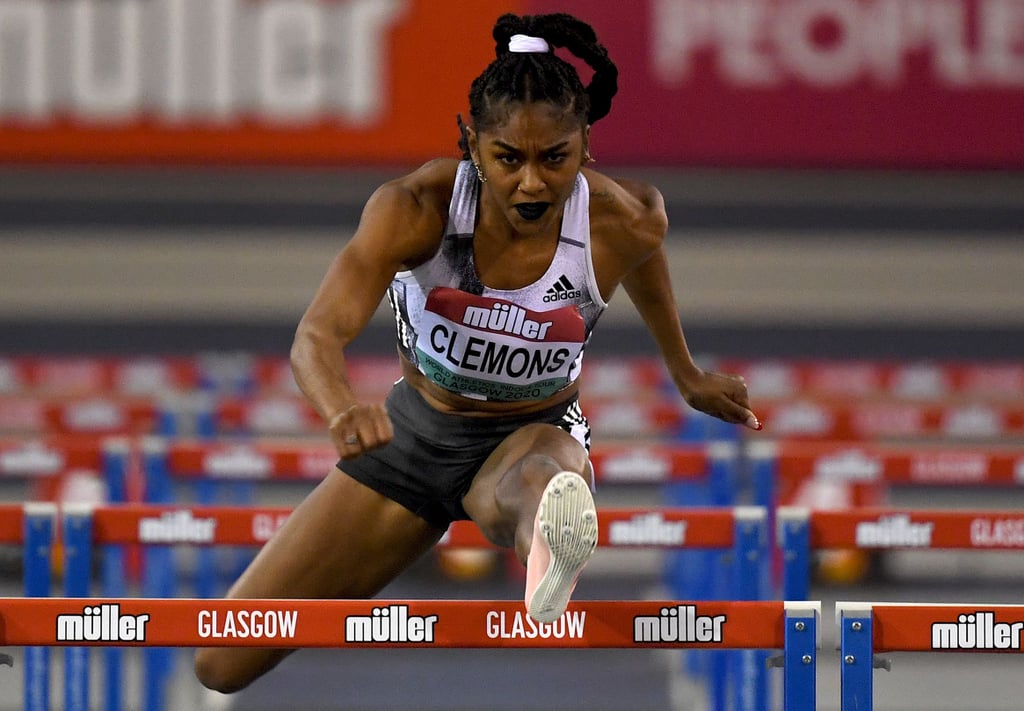 Wearing a long braid, white scrunchie, and dark lipstick at the 2020 Muller Indoor Grand Prix World Athletics Tour in Scotland.