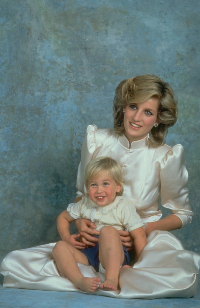 Diana forwent a formal pose and held William in her lap for their official portraits in 1984.