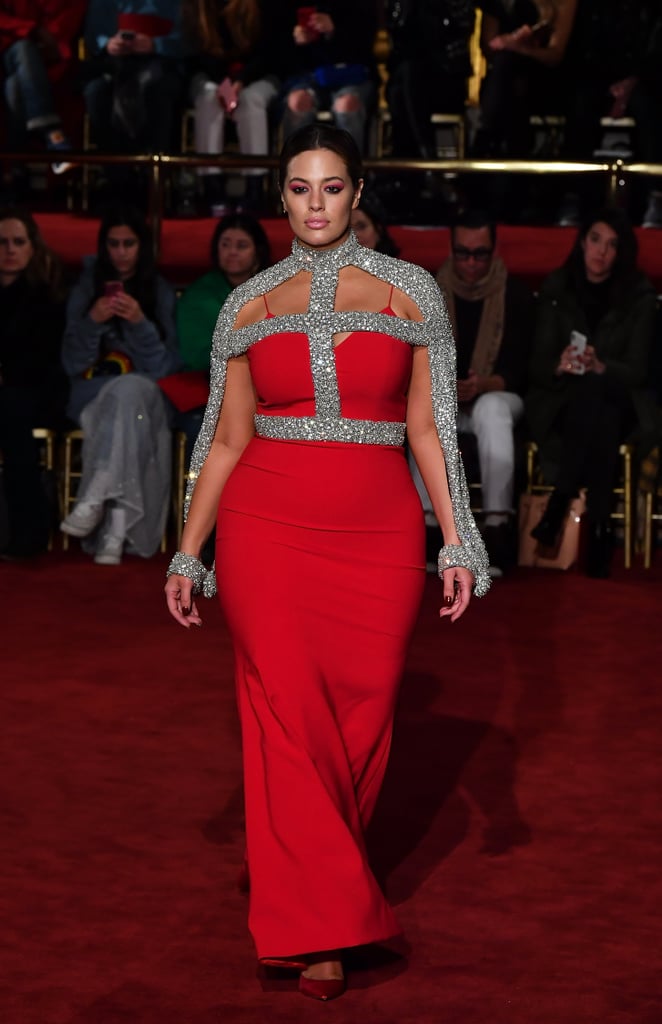 Turning heads on the runway wearing a gorgeous red and silver gown by Christian Siriano.