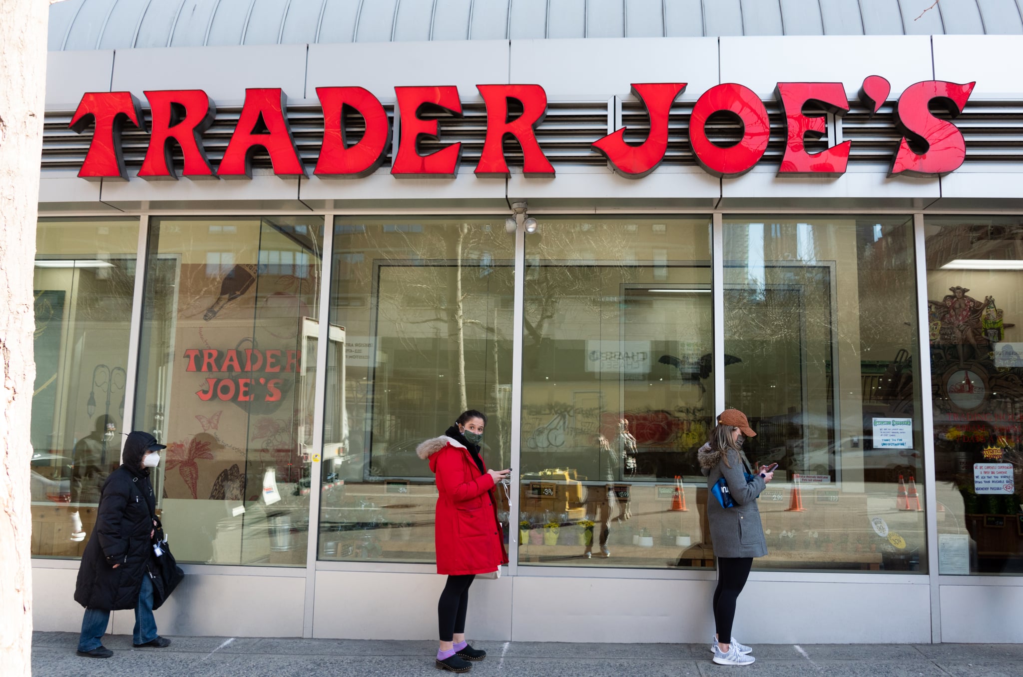 NEW YORK, NEW YORK - MARCH 19: People stand in line outside Trader Joe's in Kips Bay amid the coronavirus pandemic on March 19, 2021 in New York City. After undergoing various shutdown orders for the past 12 months the city is currently in phase 4 of its reopening plan, allowing for the reopening of low-risk outdoor activities, movie and television productions, indoor dining as well as the opening of movie theatres, all with capacity restrictions. (Photo by Noam Galai/Getty Images)