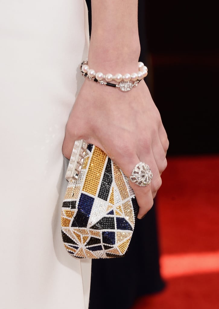 Laura Carmichael's multicolored minaudière and Chanel fine jewelry ring and bracelet were perfectly matched.