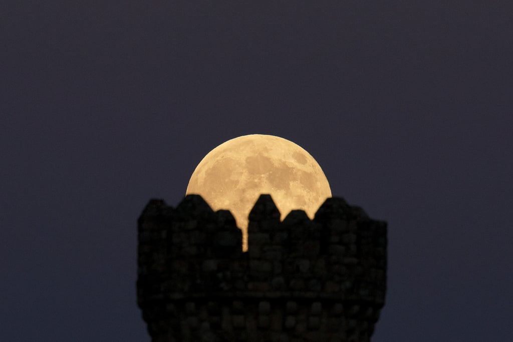 The supermoon aligns perfectly with the Torrelodones Tower on Aug. 10.