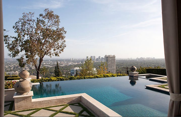 The infinity edge pool gives the mansion a modern touch.