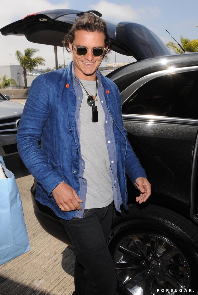Orlando Bloom grinned as he arrived at LAX on Monday.