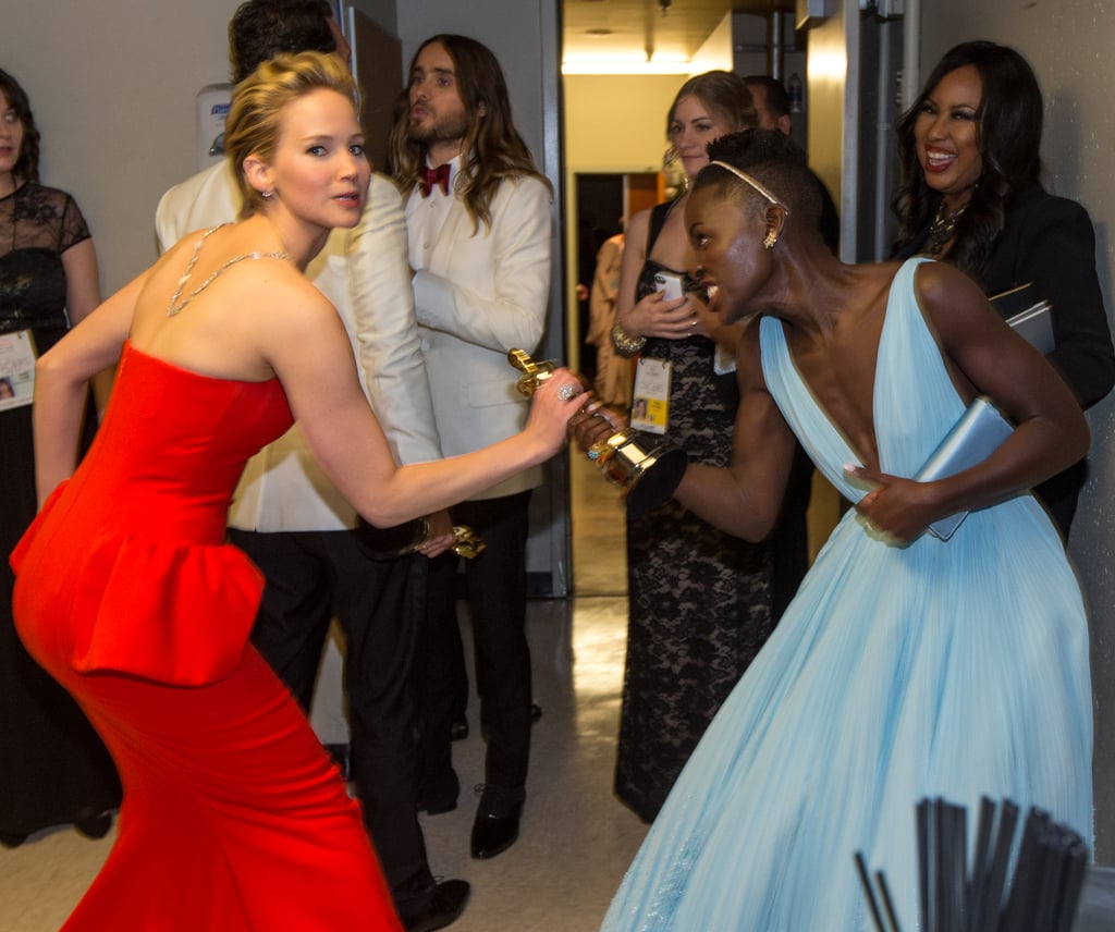 Jennifer Lawrence got grabby backstage when she tried to take Lupita Nyong'o's best supporting actress Oscar out of her hands.