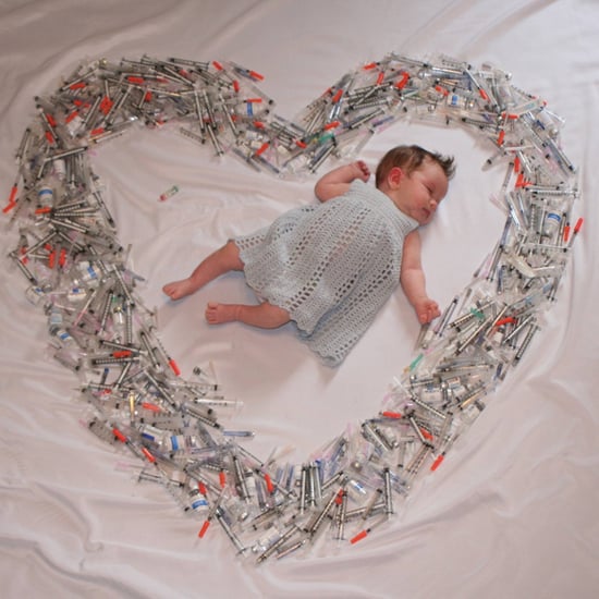 Photo of Baby Surrounded by Syringes