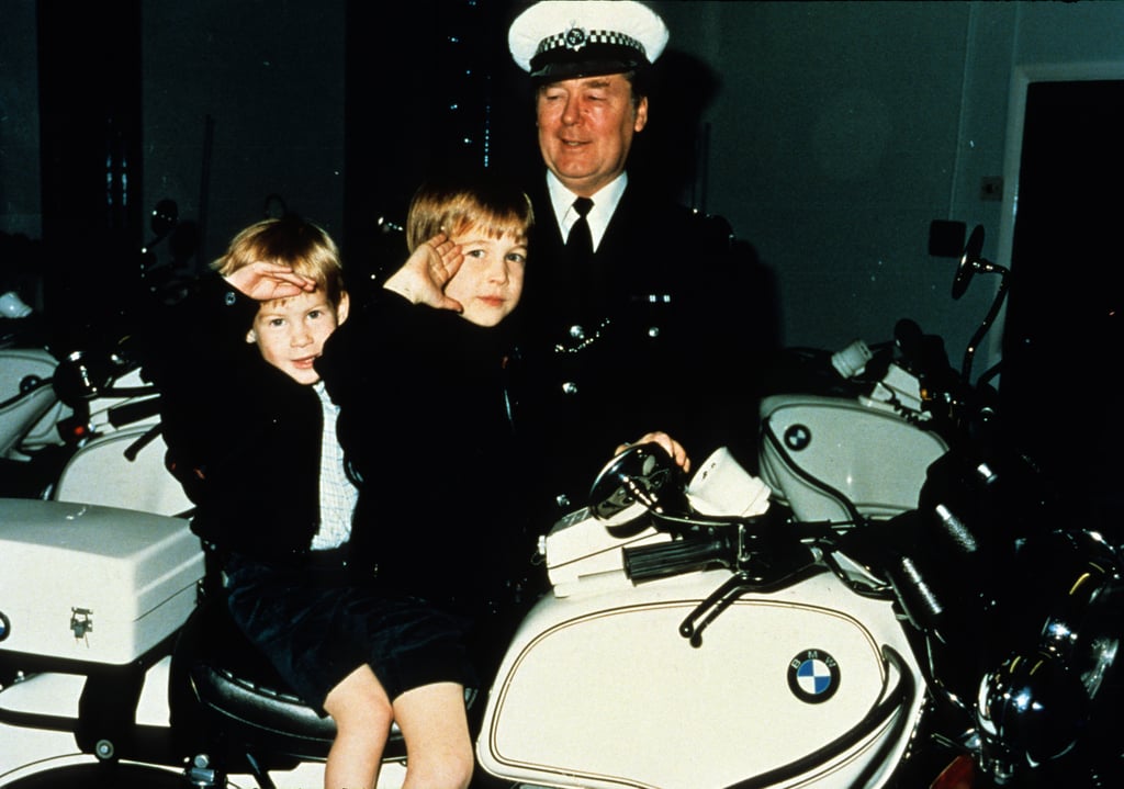Prince William and Prince Harry sat atop a police motorbike in November 1987 in Windsor, England.