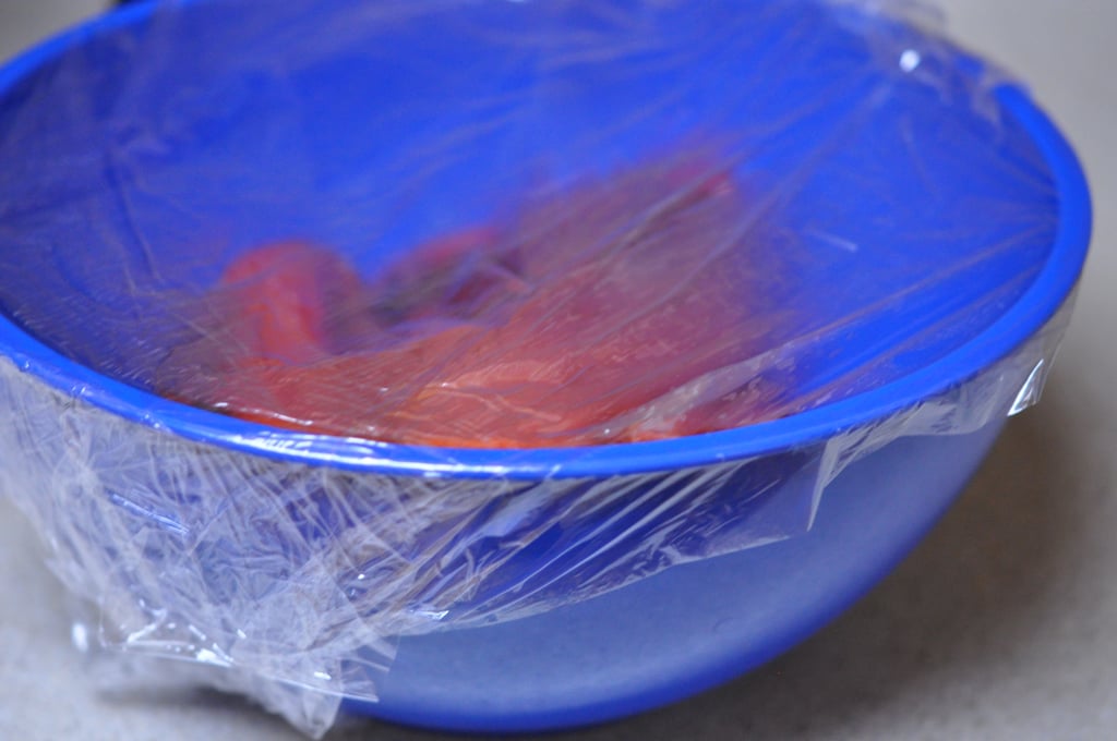 Carefully place the peppers in a large bowl and cover with saran wrap. Alternately, place the peppers in a large Ziploc or brown paper bag and seal it shut. Allow them to sit for 15 to 20 minutes.