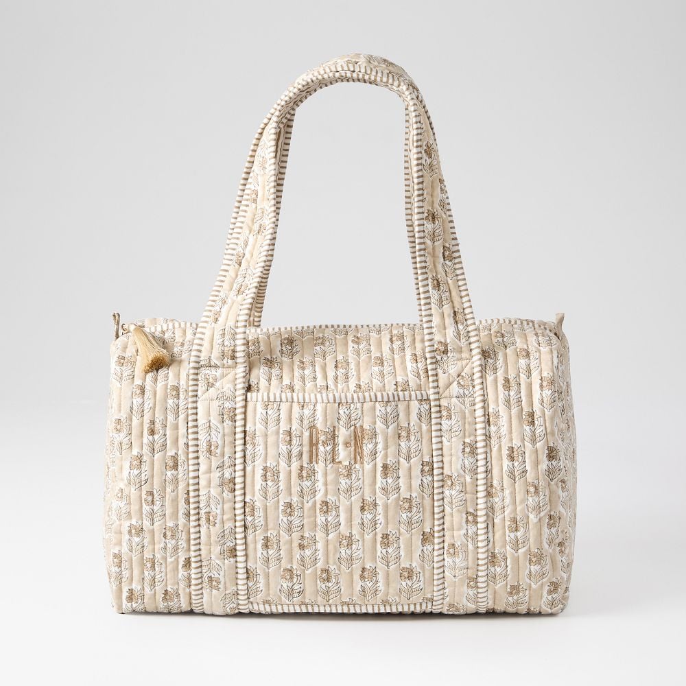 Mark & Graham Block Print Quilted Weekender ($68, originally $119)
Never underestimate the power of a monogram. While this might look like a typical quilted overnight bag, the subtle personalization makes this a lifelong travel staple. Available in 10 colors, you can find the perfect print to fit your personality. Plus, September 2 through the 9, Mark & Graham will have up to 60 percent off select items and free shipping on purchases over $150.