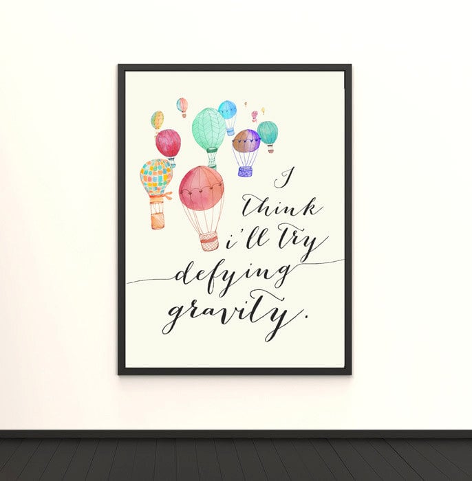 This print ($13) features the motivational song lyric "I think I'll try defying gravity."