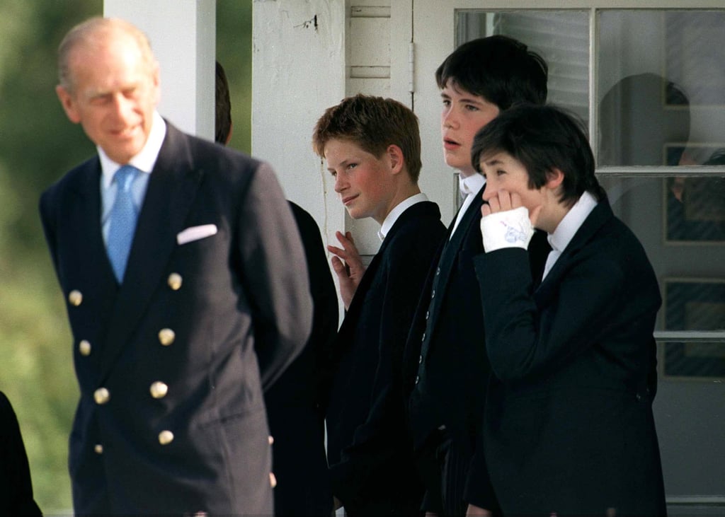 At the Eton Boys Tea Party in Windsor in June 1999, a 14-year-old Harry looked proudly at his grandfather.